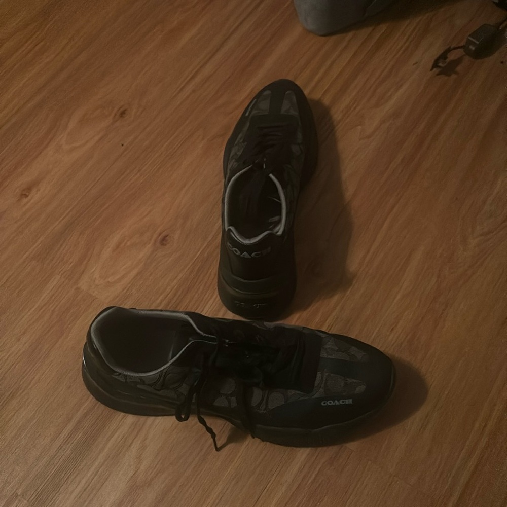 Black and grey Coach shoes